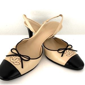 Chanel slingback beige with black kitten heels. In excellent condition.